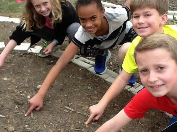 Photo of children examining the garden