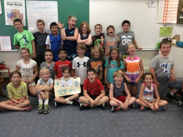 Group of students celebrating the symbolic migration