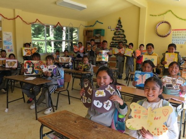 Students holding ambassador monarchs