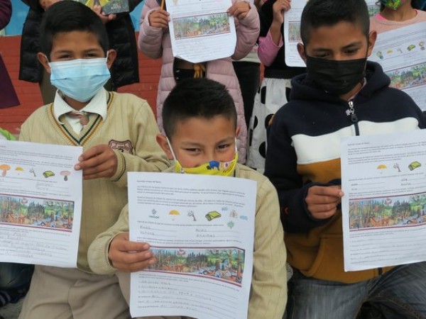 Students holding letters for Symbolic Migration