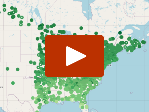 A map of the eastern U.S. with a red play button over it